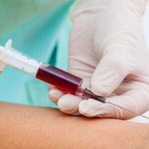 a nurse taking a blood sample